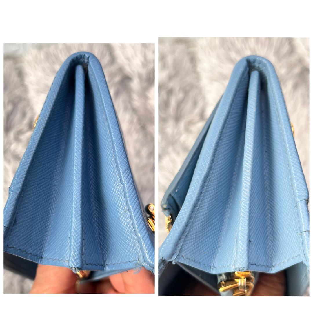 良品✨PRADA メタルバー　メタルロゴ　長財布 サフィアーノ　水色　レディース