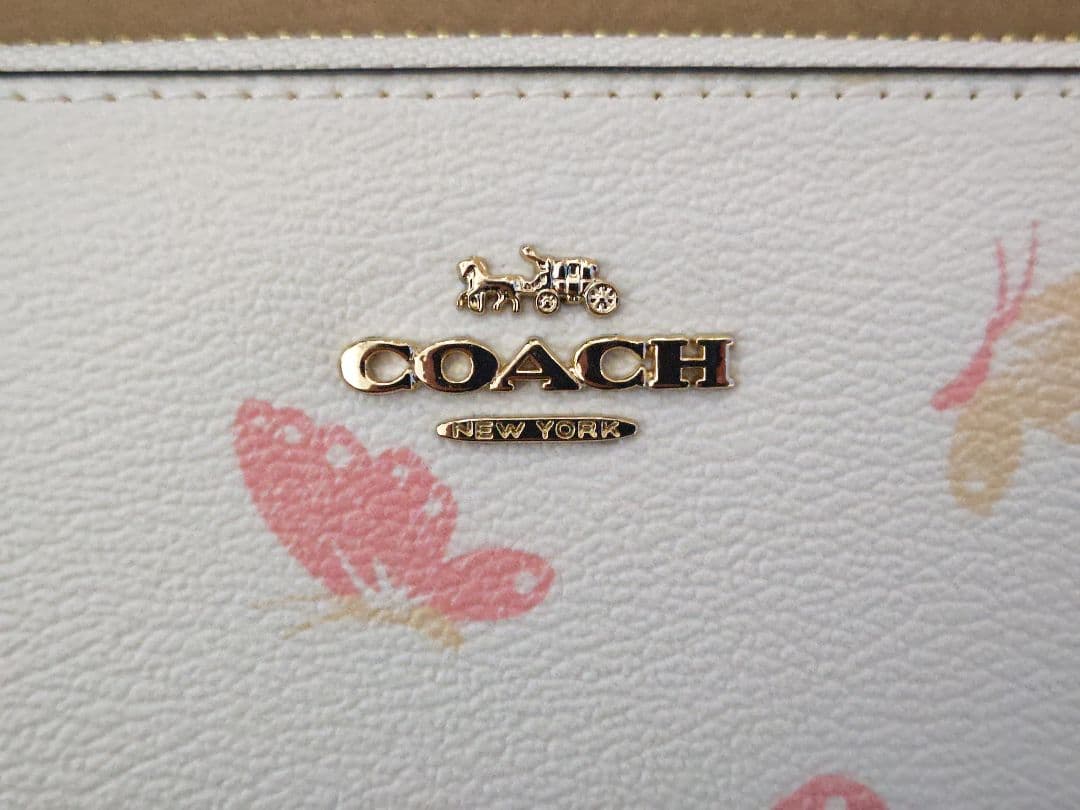 COACH 正規アウトレット品 レディース長財布 ホワイト/クリーム 蝶々柄