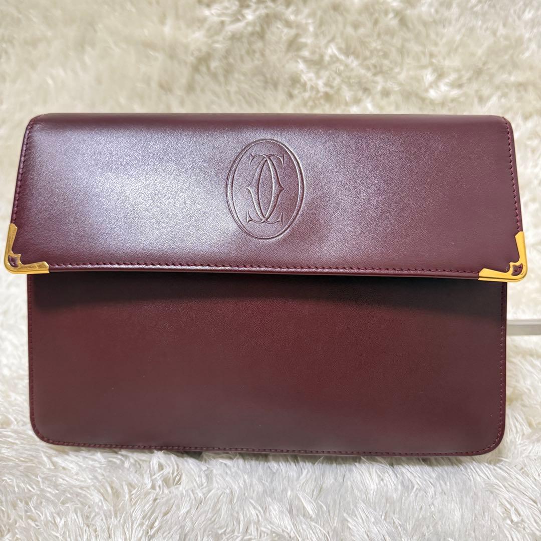 カルティエ　マストライン　クラッチバッグ　ボルドー　ロゴ金具