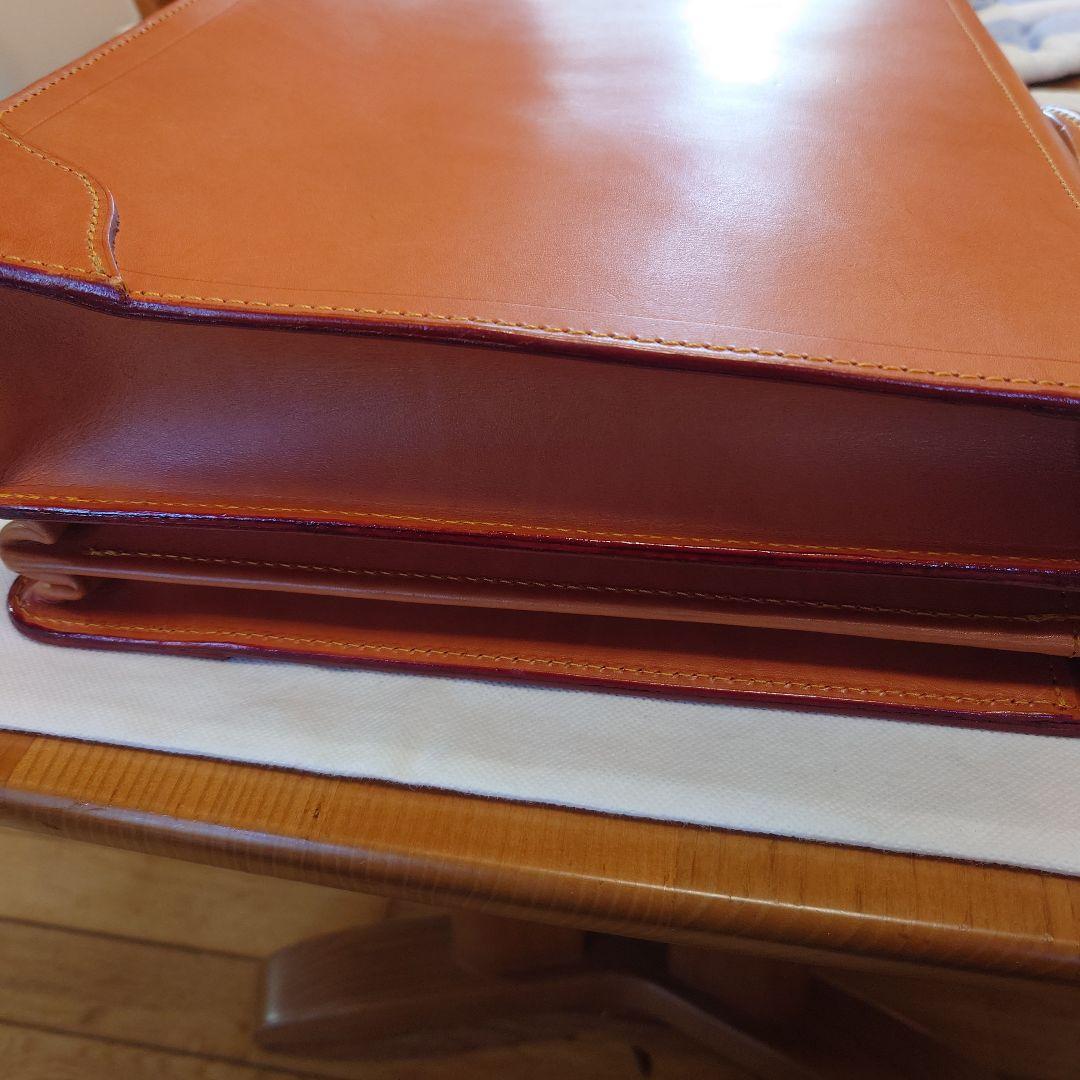 FIVEWOODSオレンジ レザービジネスバッグ（保管袋付き：PRADA）