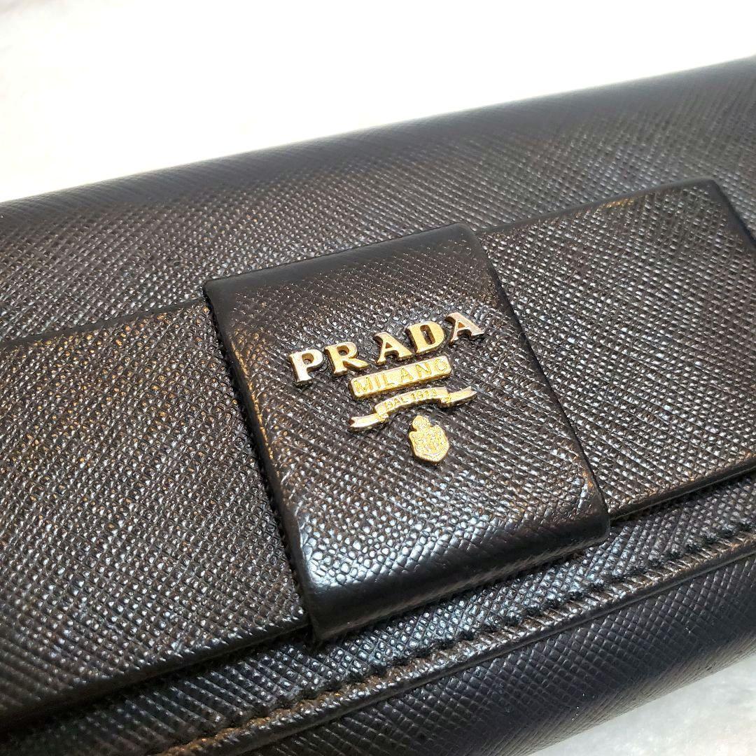 美品 プラダ　長財布 サフィアーノ フィオッコ ライト黒 メタルロゴ リボン