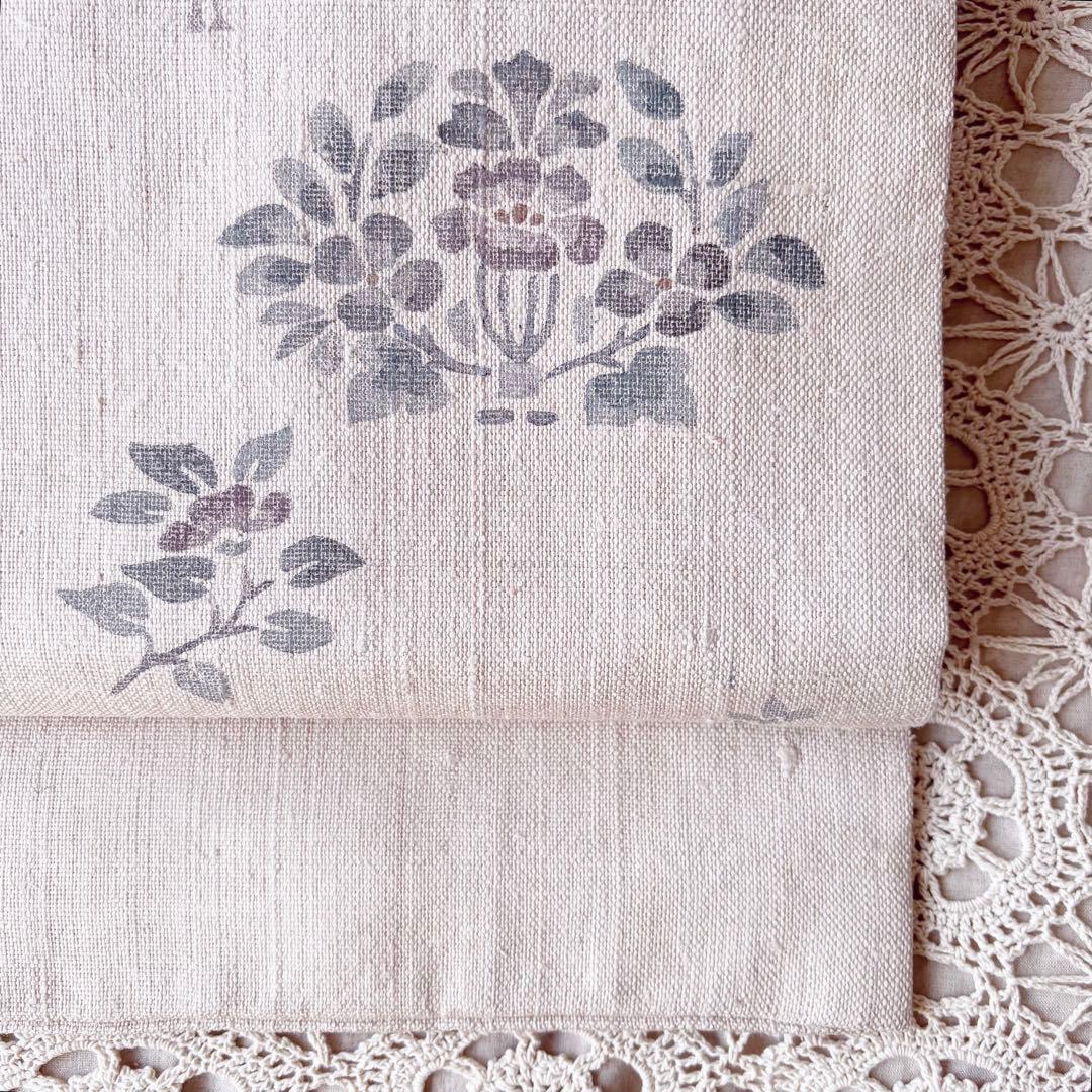 花と鳥の模様 くすんだピンクグレー ピンクベージュ 名古屋帯 紬帯