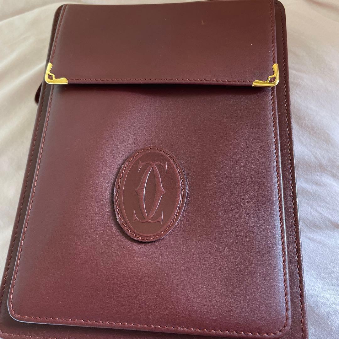 未使用　極美品　カルティエCartier ハンドバッグ　クラッチバッグ　エンジ色